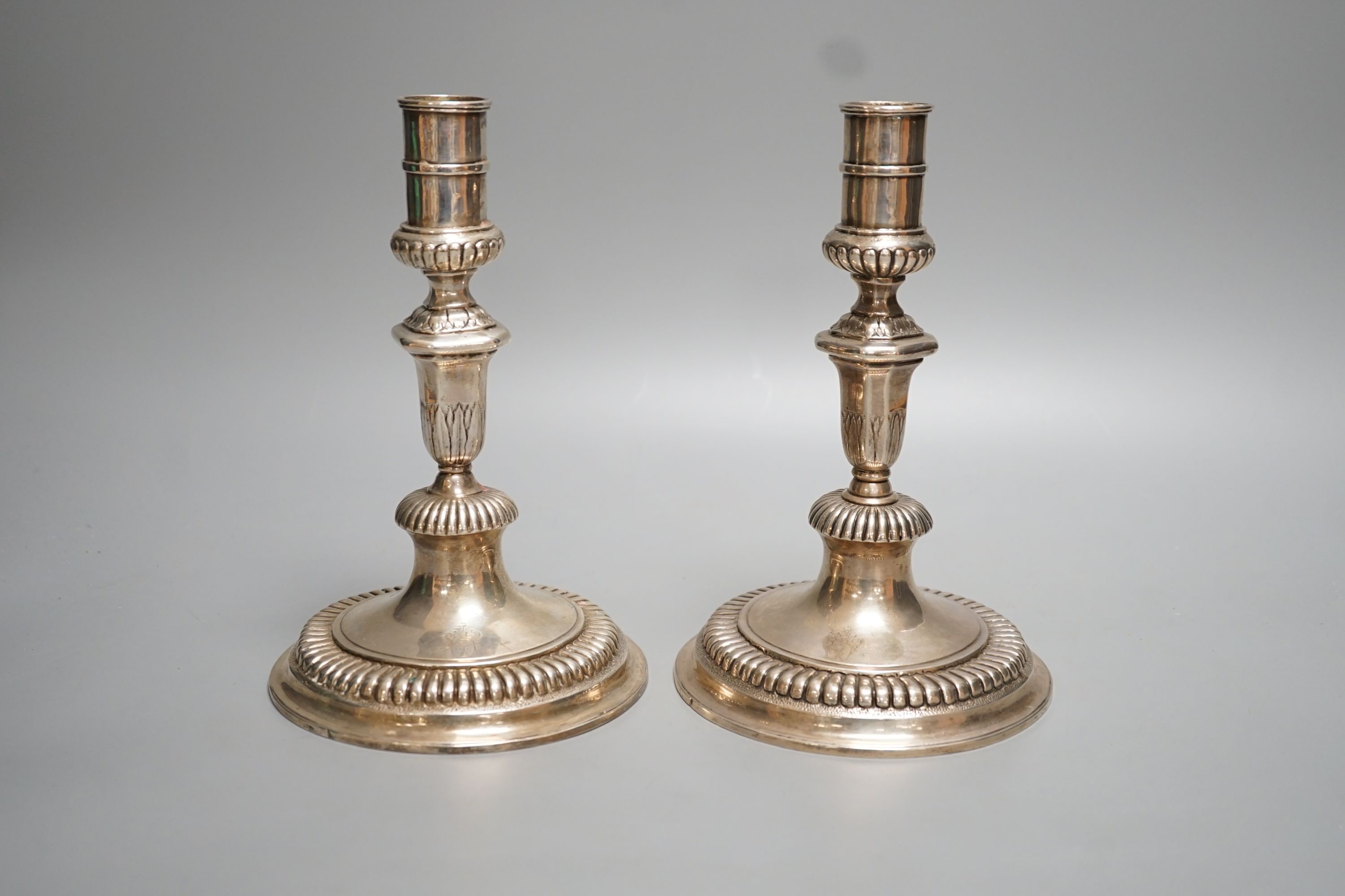 A pair of late 18th/early 19th century German? white metal candlesticks, 19.7cm, 18oz.